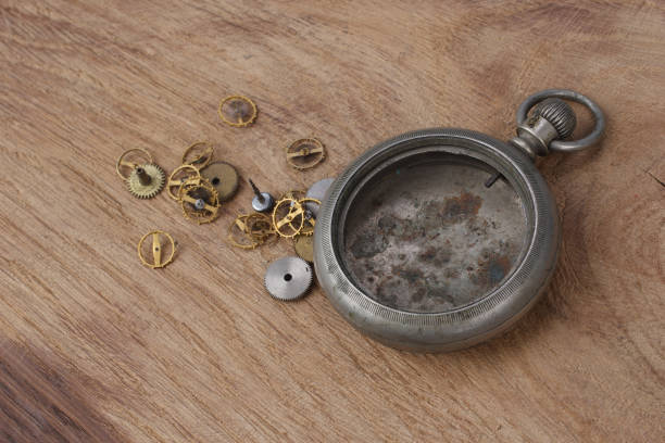 istock broken vintage pocket watch on wooden background 917929368