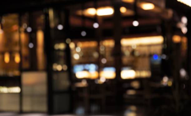 istock Blurred background: Restaurant with tables and chairs blur background. 917936360