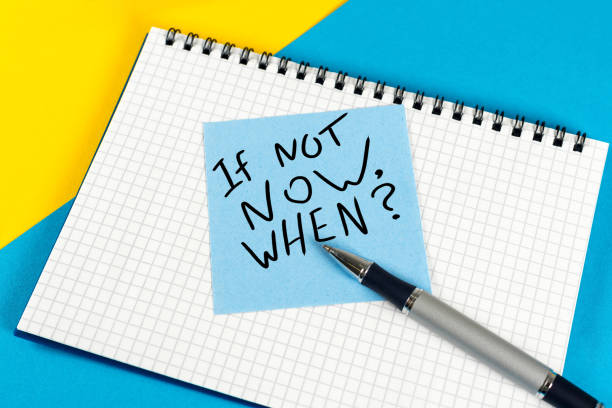 istock If Not Now When - question in note at workplace. Goals Ambition Concept 917936694