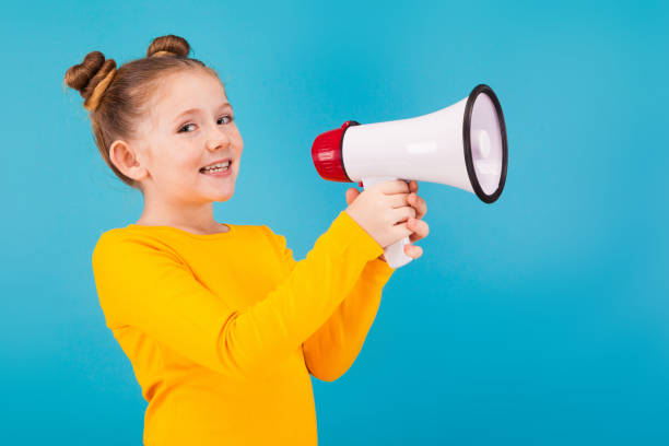 istock a little pretty girl with megaphone 917936986