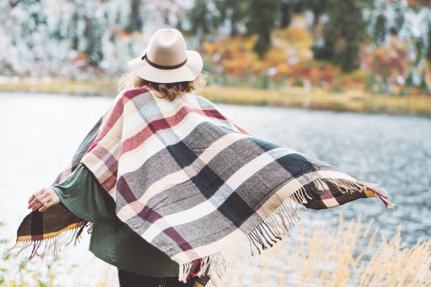 istock Woman traveling among mountains wilderness, boho style 917938010