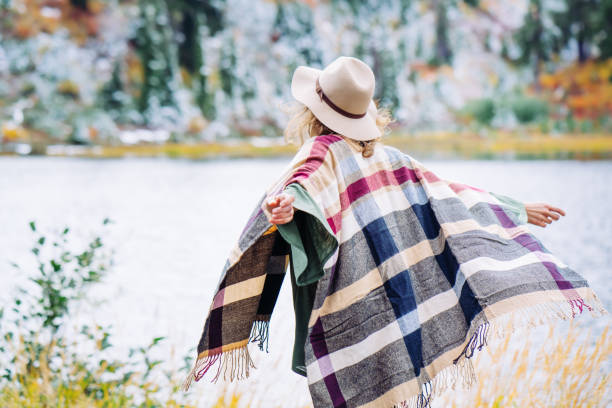 istock Woman traveling among mountains wilderness, boho style 917938104