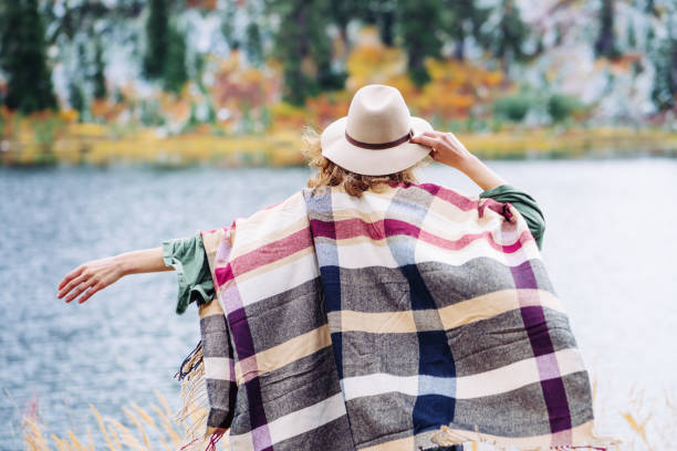 istock Woman traveling among mountains wilderness, boho style 917938108