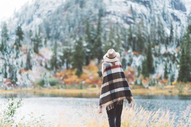 istock Woman traveling among mountains, boho style 917940358