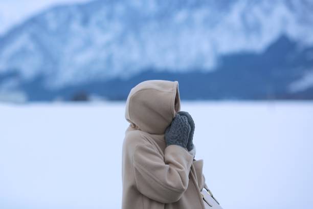 istock Young Woman wearing  hooded coat 917940476