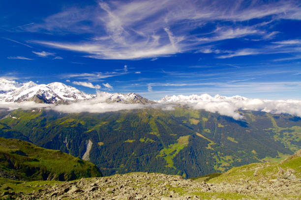 istock Snow-Capped Alpine Summits in the Clouds 917940644