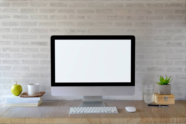 istock Workspace mockup desk with desktop computer and office supplies. Blank screen monitor for graphic display montage. 917941274