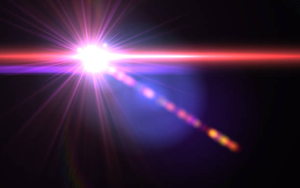 istock Abstract Lens Flare dusty with black background.Modern abstract beautiful rays light streak background.Gold sun light flare effect 917950212