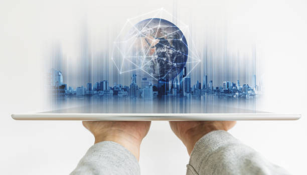 Hand holding digital tablet with global network connection technology and modern buildings hologram, on white background. Element of this image are furnished by NASA Hand holding digital tablet with global network connection technology and modern buildings hologram, on white background. Element of this image are furnished by NASA global communications white stock pictures, royalty-free photos & images