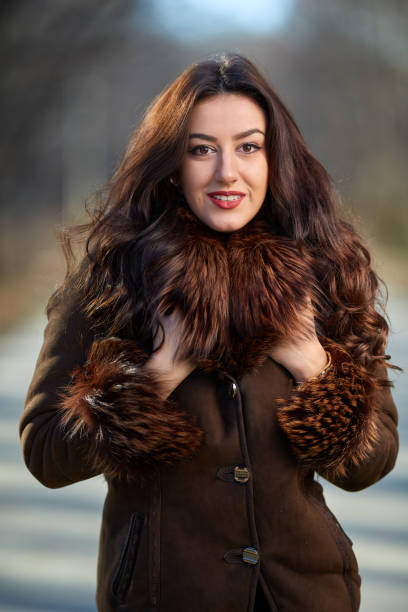 istock Woman in brown jacket outdoor 917955194