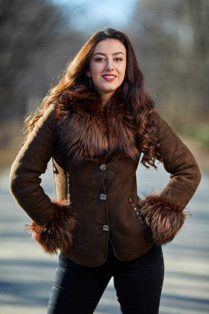 istock Woman in brown jacket outdoor 917955198