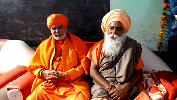 Rishikesh, Uttarakhand ,  India - December 1, 2019 : Indian hindu devotee monks(sadhu) around famous Swarg Ashram  in pilgrimage tourist spot Rishikesh
