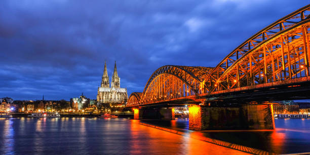 istock Cologne Cathedral and Hohenzollern Bridge at Twilight Time in Germany 917961104