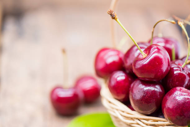 istock Fresh Cherry from farm, sweet and sour fruit, wooden table background 917963924