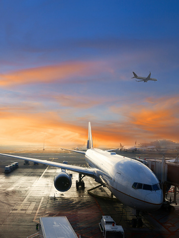 View of airplane at International Airport at sunrise