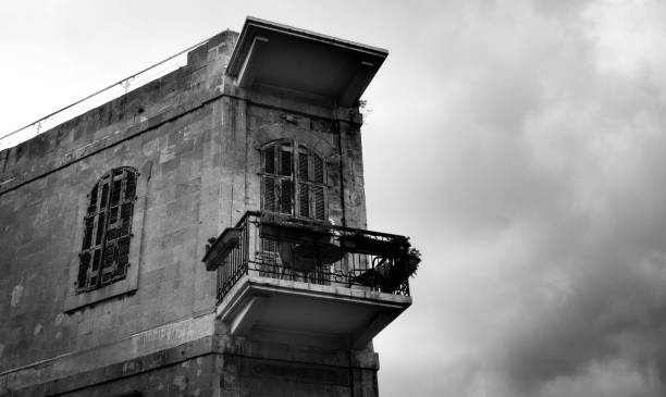 istock Black and White View of Old Balcony on Small Building 917968546