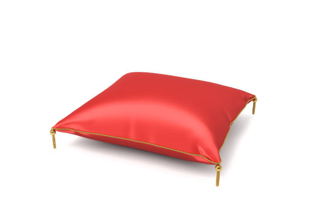istock 3d rendering of a red silk decorative pillow with golden tussels in side view on a white background 917971736