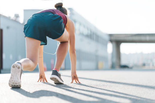 istock Woman preparing for start, low running position 917974402