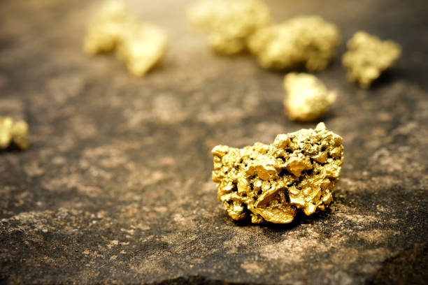istock The pure gold ore found in the mine on a stone floor 917977510