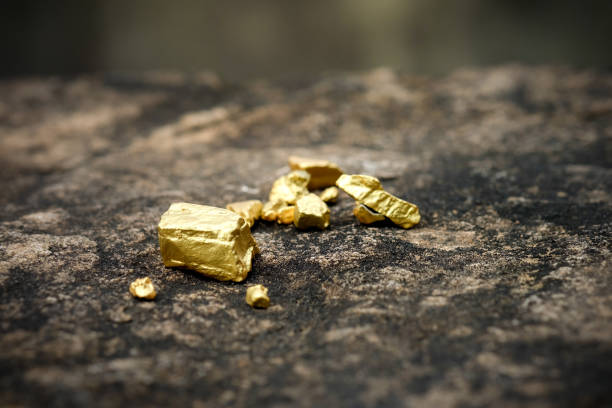 istock The pure gold ore found in the mine on a stone floor 917977520