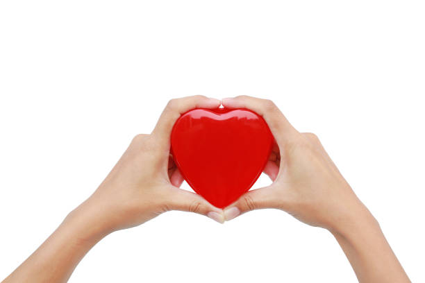 istock Hands holding small gift heart on Valentine's Day isolated on white background. 917981226