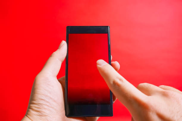 istock The smartphone which is operated. danger site, cation, prohibited from reading, etc. red background 917987512