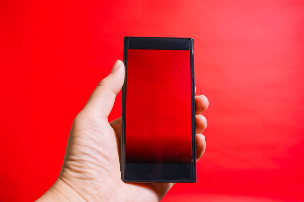 istock The smartphone which is operated. danger site, cation, prohibited from reading, etc. red background 917987514