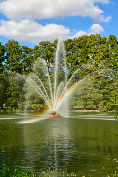 istock Rainbow Beam of Light from Fountain in Park 917990632