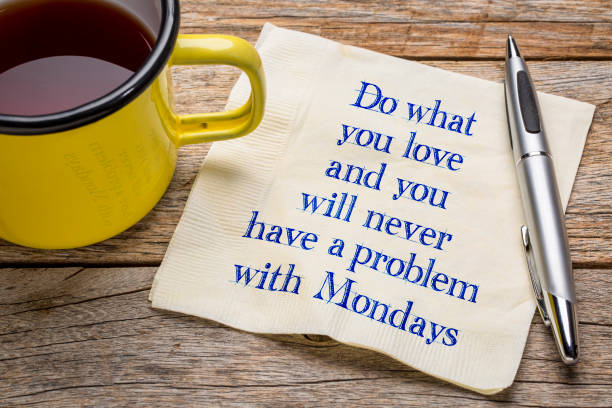 Do what you love and ... napkin note Do what you love and you will never have a problem with Mondays - handwriting on napkin with a cup of tea monday stock pictures, royalty-free photos & images