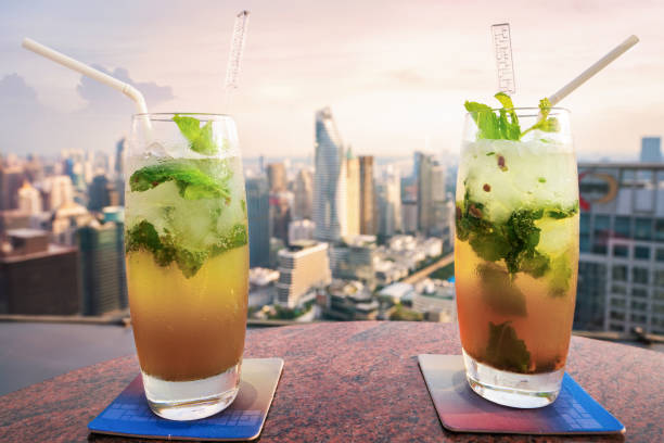 istock Mojito cocktail on table in rooftop bar in Bangkok city 917991310