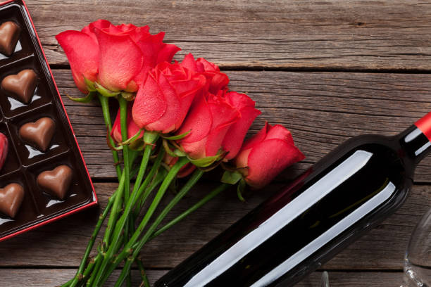 istock Red roses, wine bottle and chocolate box 917998600
