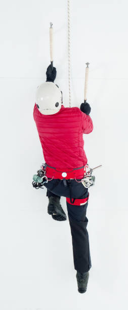 istock Male ice climber climbing 918003768