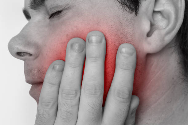 istock Man with a painful expression is having toothache 918006324