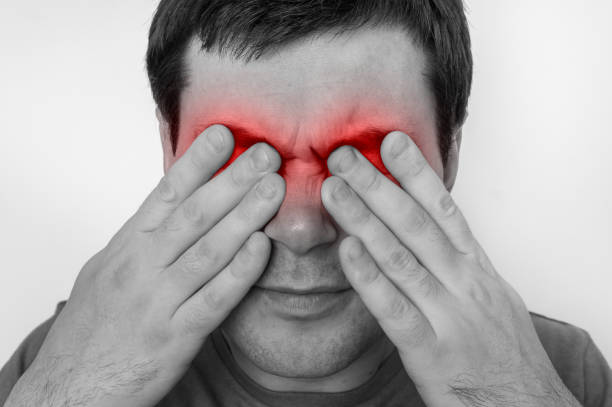 istock Man with eyes pain is holding his aching eyes 918006466