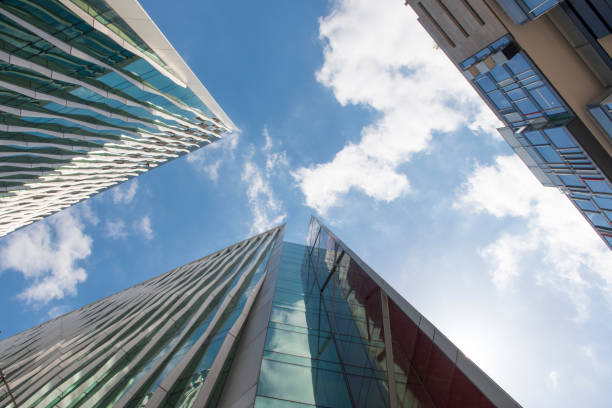 istock Office Buildings Exterior Viewed from Below with Sky in Background 918006902