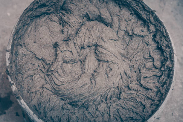 istock Finished plaster in a bucket, mixed with a mixer, facing works 918007454