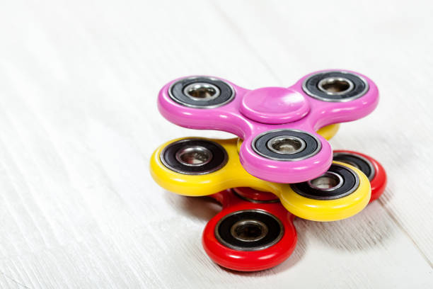 istock Group of spinners on wooden table 918012510