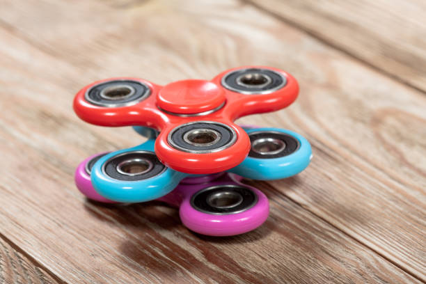 istock Group of spinners on wooden table 918012702