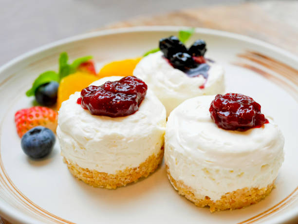 istock Delicious cheesecake with strawberry and blueberry sauce 918012838
