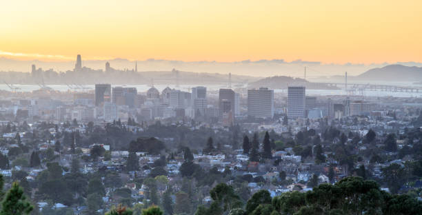 istock Sunset over Oakland and San Francisco Hazy Skylines. 918014992