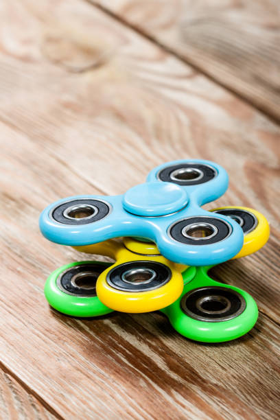 istock Group of spinners on wooden table 918015168