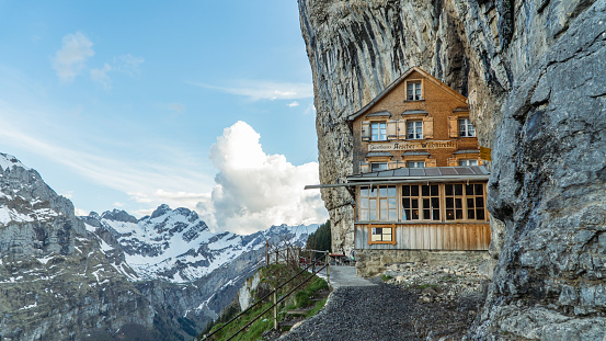 Ebenalp, Switzerland, May 2017: Ebenalp with its famous cliff inn Aescher. Ebenalp is an attractive recreation region for hiking, climbing, skiing and paragliding in Appenzell, Switzerland