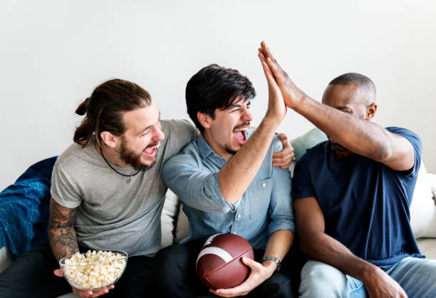 istock Friends cheering sport league together 918016544