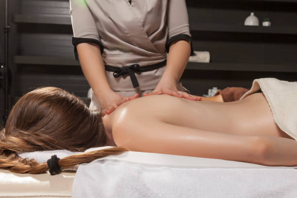 istock Young woman enjoying oil massage 918019044
