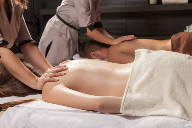 istock Young couple receiving back massage. 918019128