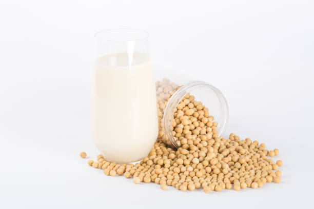 istock Soy milk in glass and soybeans 918019164