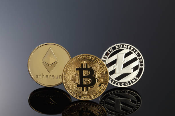 Close up shot of three main cryptocurrencies; bitcoin, ethereum and litecoin in dark surface. Tokyo,Japan-february 13 ,2018: Studio shot of  ethereum, litecoins, Bitcoin, on black background.Digital virtual currency litecoin stock pictures, royalty-free photos & images