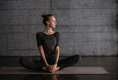 Beautiful woman relaxing after yoga