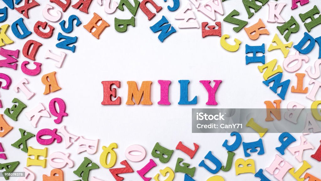 Baby name EMILY composed of wooden letters on floor. Choosing name concept Baby name EMILY composed of wooden letters on floor. Baby - Human Age Stock Photo