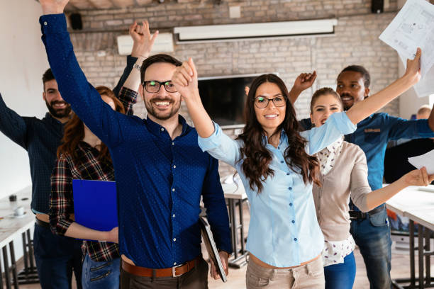 istock Group of successful young architects posing in office 918020256